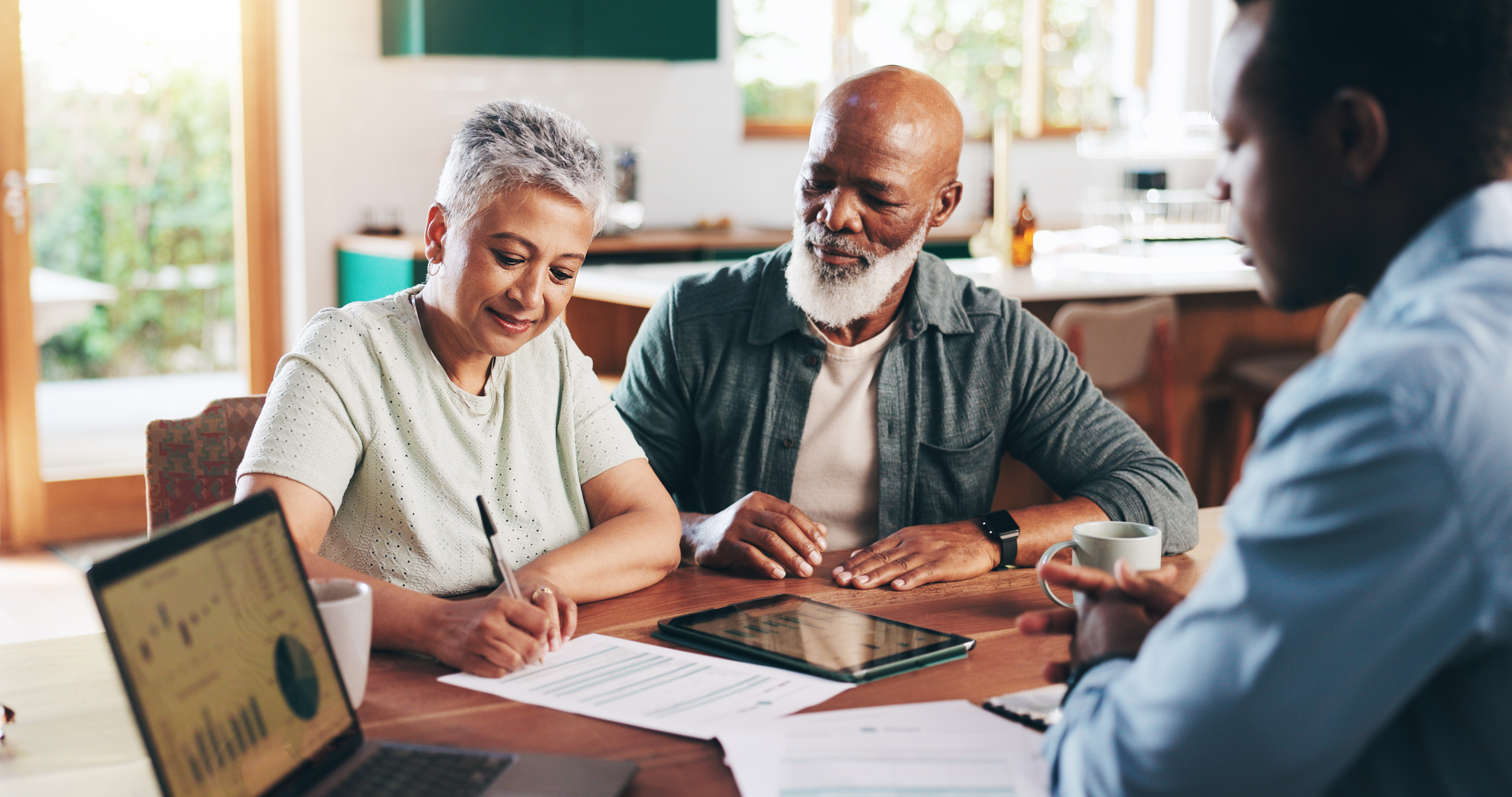 Mature couple smiling after finding the right Medicare plan for them.